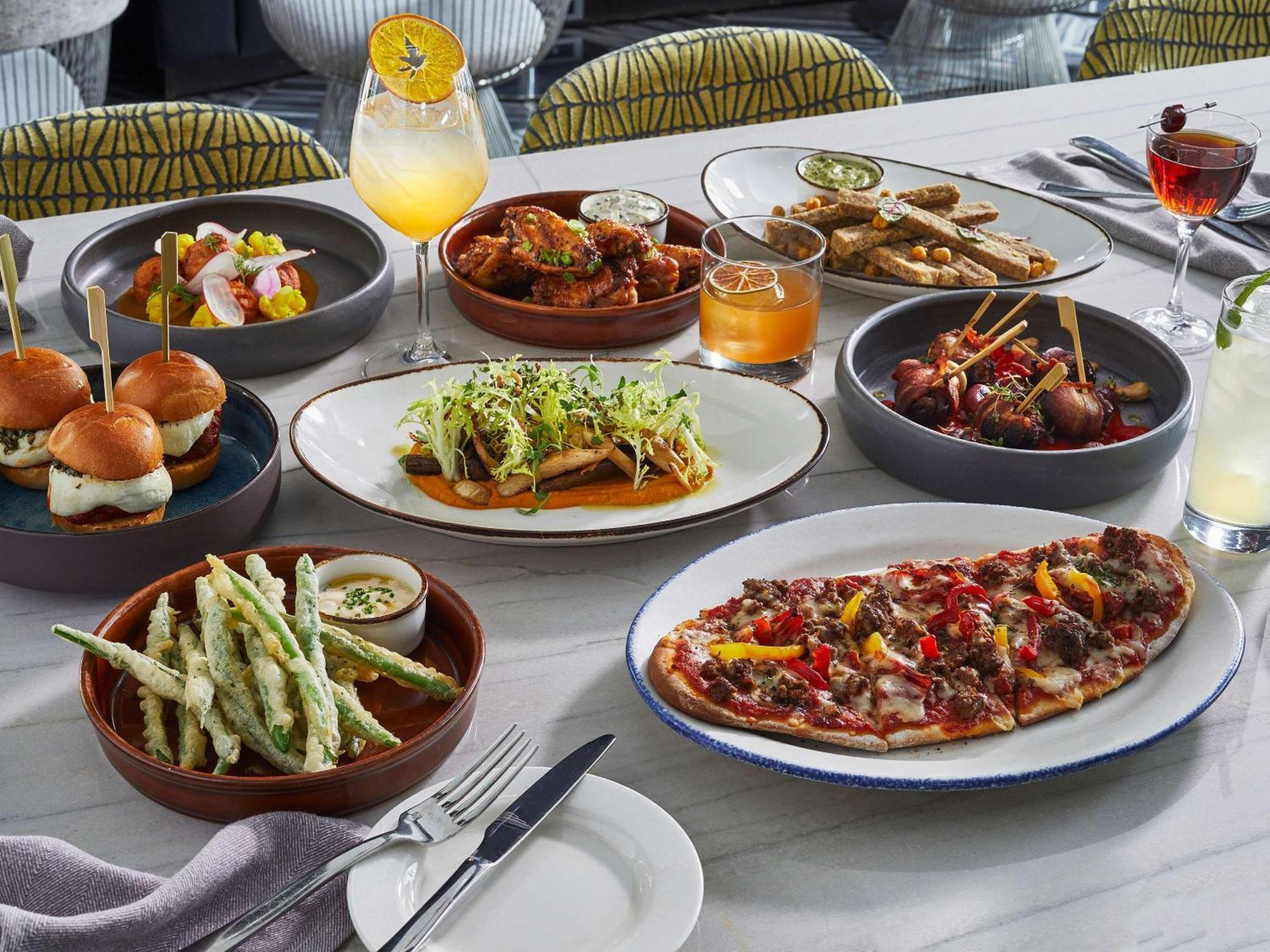 Sofitel Chicago Magnificent Mile Hotel Exterior photo A selection of dishes from the restaurant